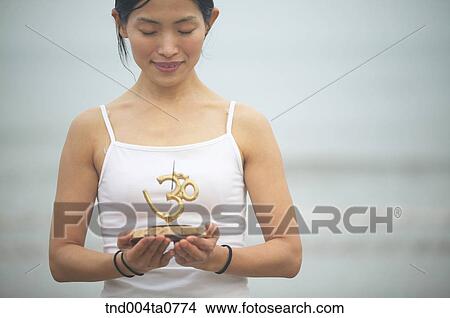 a woman holding an incense burner View Large Photo Image Picture - a woman holding an incense burner. Fotosearch