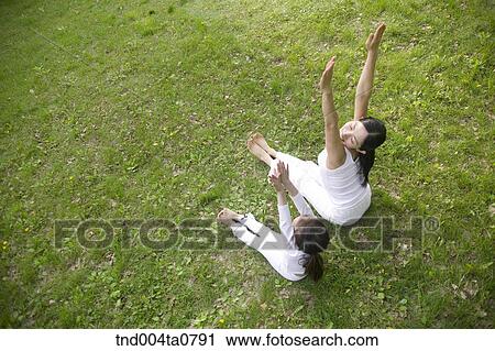 Yoga/ a woman and a child doing yoga View Large Photo Image Stock Image - Yoga/ a woman and a child doing yoga. Fotosearch
