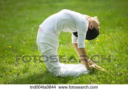 Picture - Yoga/ a woman doing yoga. Fotosearch