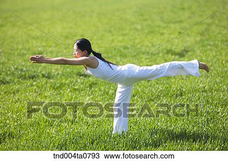 Stock Image - Yoga/ a woman doing yoga. Fotosearch