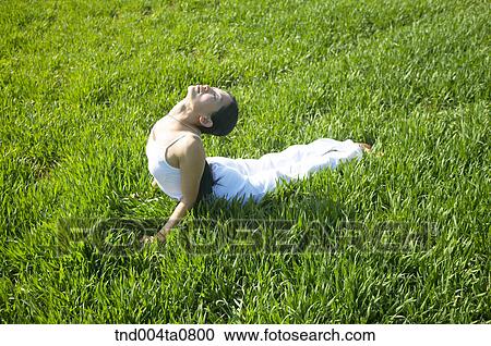 Stock Image - Yoga/ a woman doing yoga. Fotosearch