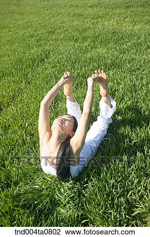 Yoga/ a woman doing yoga View Large Photo Image Stock Image - Yoga/ a woman doing yoga. Fotosearch