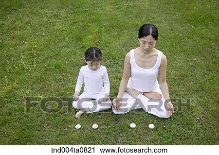 Stock Image - Yoga/ a woman doing yoga. Fotosearch