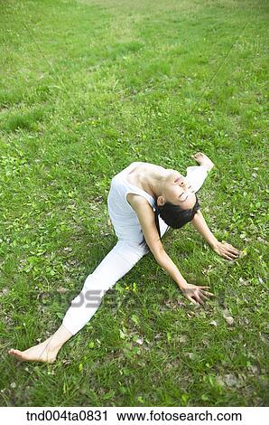 Stock Image - Yoga/ a woman doing yoga. Fotosearch