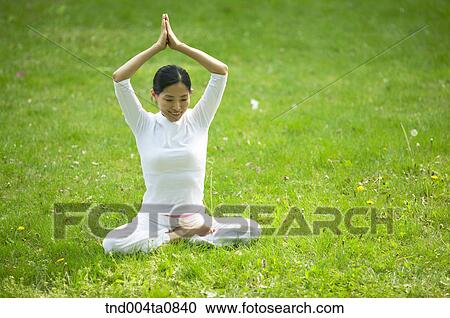 Stock Image - Yoga/ a woman doing yoga. Fotosearch