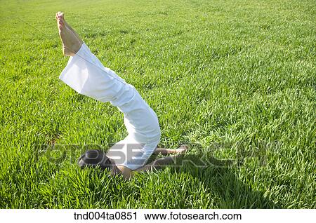 Stock Image - Yoga/ a woman doing yoga. Fotosearch
