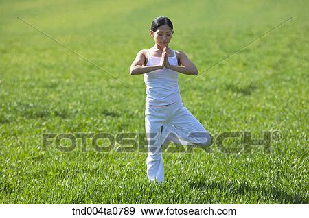 Stock Photo - Yoga/ a woman doing yoga. Fotosearch