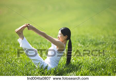 Stock Photo - Yoga/ a woman doing yoga. Fotosearch