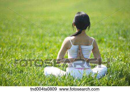 Stock Photo - Yoga/ a woman doing yoga. Fotosearch