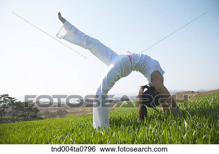 Yoga/ a woman doing yoga View Large Photo Image Stock Photograph - Yoga/ a woman doing yoga. Fotosearch