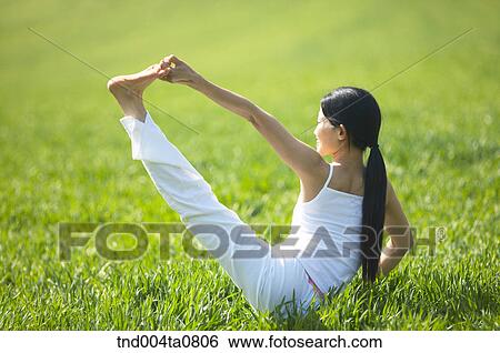 Stock Photograph - Yoga/ a woman doing yoga. Fotosearch