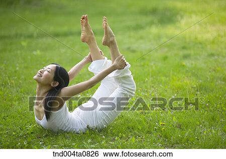 Stock Photograph - Yoga/ a woman doing yoga. Fotosearch