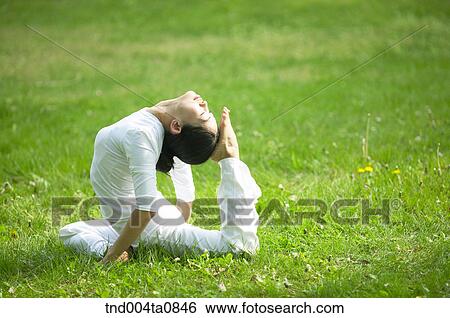 Yoga/ a woman doing yoga View Large Photo Image Stock Photograph - Yoga/ a woman doing yoga. Fotosearch