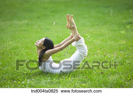 Stock Photography - Yoga/ a woman doing yoga. Fotosearch