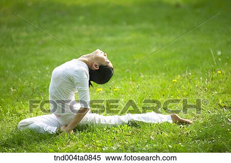 Stock Photography - Yoga/ a woman doing yoga. Fotosearch