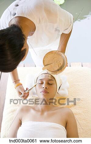 Stock Image - beauty/ massaging. Fotosearch