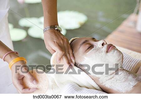 Stock Photo - beauty/ massaging. Fotosearch