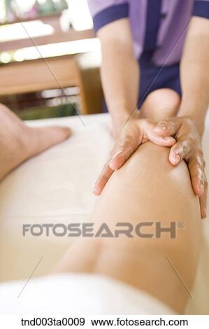 spa/ a massager putting an oil View Large Photo Image Stock Photo - spa/ a massager putting an oil. Fotosearch