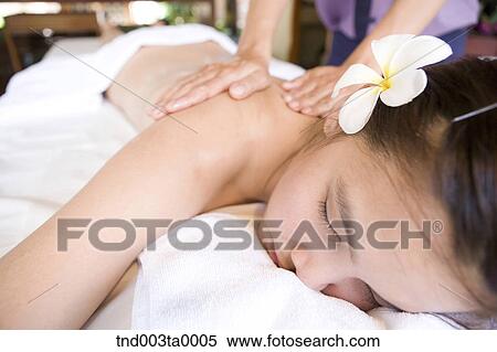 spa/ a massager putting an oil View Large Photo Image Stock Photography - spa/ a massager putting an oil. Fotosearch