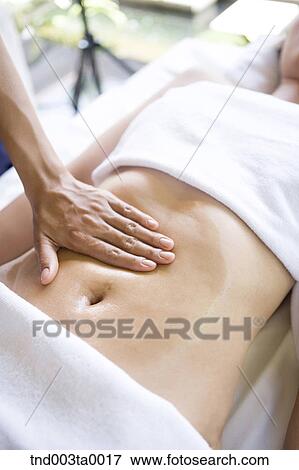 Stock Photo - spa/ a massaging woman. Fotosearch
