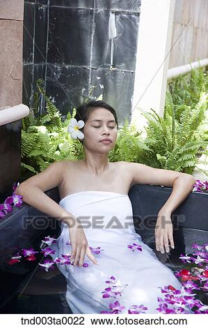 spa/ a woman in a bath tub View Large Photo Image Stock Image - spa/ a woman in a bath tub. Fotosearch