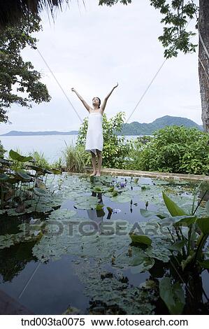 Stock Photography - spa/ a woman in a garden. Fotosearch