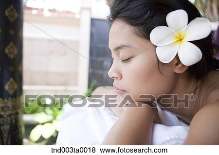 spa/ a woman lying on a massage table View Large Photo Image Stock Photo - spa/ a woman lying on a massage table. Fotosearch