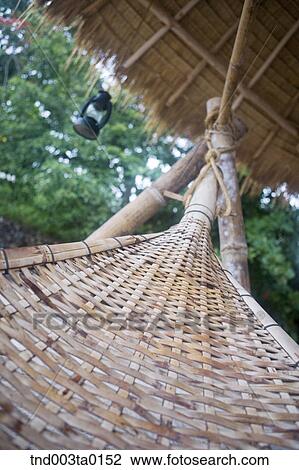 Stock Image - resort, hammocks in tropics. Fotosearch