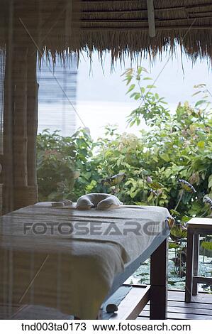 spa, a massage table and a curtain View Large Photo Image Stock Image - spa, a massage table and a curtain. Fotosearch