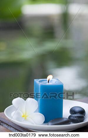 spa, aroma therapy candle, pebbles and white flowers View Large Photo Image Stock Photo - spa, aroma therapy candle, pebbles and white flowers. Fotosearch
