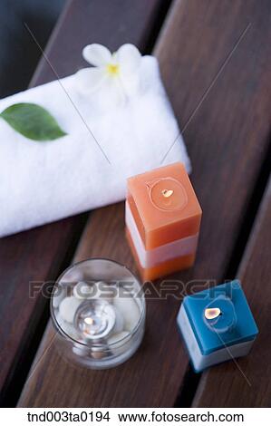 spa, aroma therapy candles and a towel View Large Photo Image Picture - spa, aroma therapy candles and a towel. Fotosearch