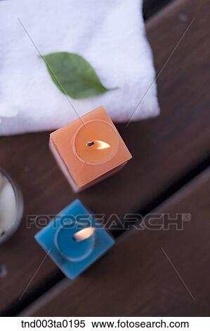 Stock Photography - spa, aroma therapy candles and a towel. Fotosearch