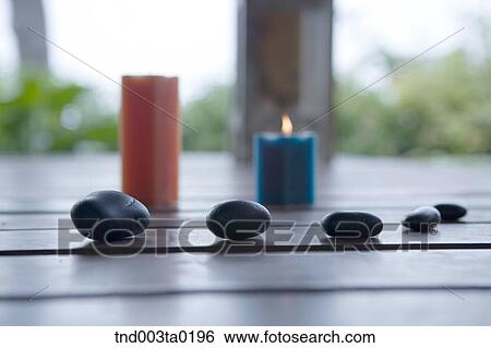 spa, aroma therapy candles and pebbles View Large Photo Image Stock Photograph - spa, aroma therapy candles and pebbles. Fotosearch