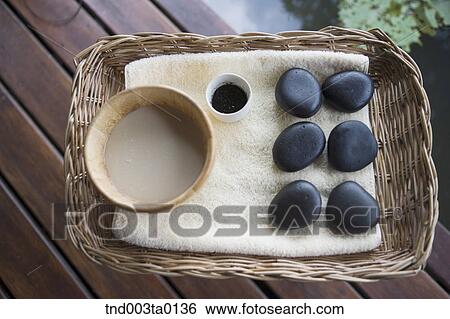spa, pebbles on a basket View Large Photo Image Stock Photograph - spa, pebbles on a basket. Fotosearch