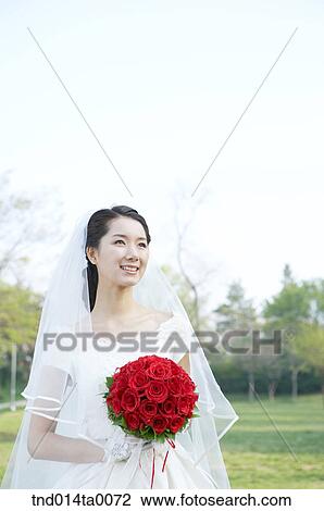Wedding, a bride holding a bouquet View Large Photo Image Stock Image - Wedding, a bride holding a bouquet. Fotosearch