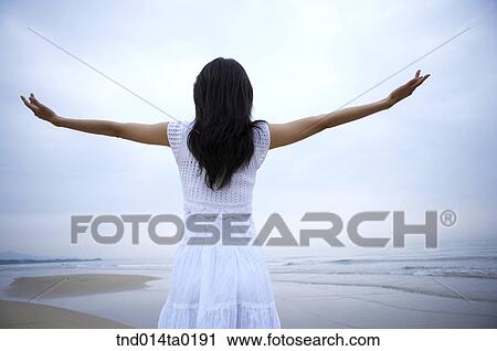 Stock Image - back figure of the couple with stretching arms. Fotosearch