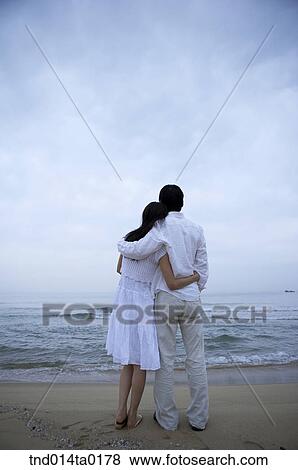 couple are in the seashore View Large Photo Image Stock Photo - couple are in the seashore. Fotosearch