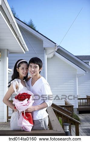 couple holding bouquet View Large Photo Image Stock Image - couple holding bouquet. Fotosearch