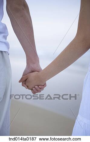 couple holding hands View Large Photo Image Stock Photo - couple holding hands . Fotosearch