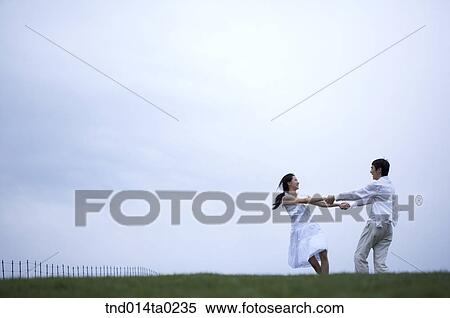 Stock Photography - couple holding hands . Fotosearch