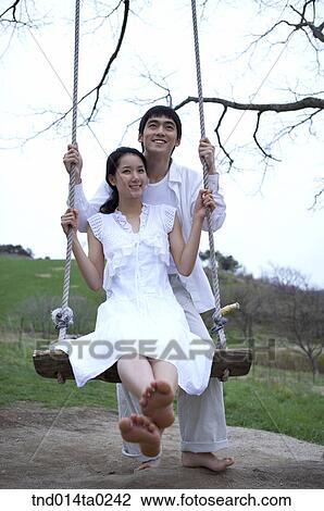 couple on the swing View Large Photo Image Stock Image - couple on the swing. Fotosearch