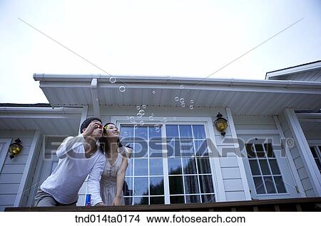 couple scewing bubbleg um View Large Photo Image Picture - couple scewing bubbleg um. Fotosearch