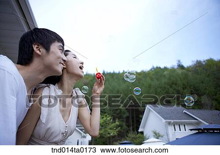couple scewing bubbleg um View Large Photo Image Stock Image - couple scewing bubbleg um. Fotosearch