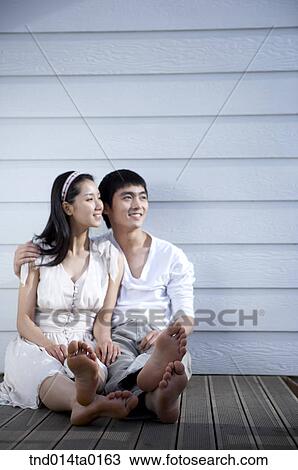 couple sitting on the balcony View Large Photo Image Stock Image - couple sitting on the balcony. Fotosearch