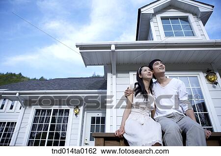 couple sitting on the railling and chat View Large Photo Image Stock Image - couple sitting on the railling and chat . Fotosearch