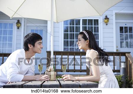 Stock Photo - couple with chatting. Fotosearch