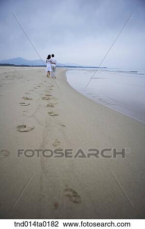 footprint of the couple walking on the seashore View Large Photo Image Stock Image - footprint of the couple walking on the seashore. Fotosearch