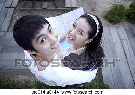 happy married couple look above with map in ther honeymoon View Large Photo Image Picture - happy married couple look above with map in ther honeymoon. Fotosearch