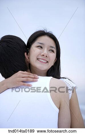 hugging couple on the seashore View Large Photo Image Stock Photo - hugging couple on the seashore. Fotosearch