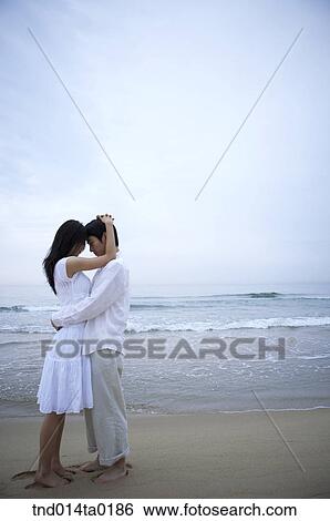 hugging couple on the seashore View Large Photo Image Stock Photograph - hugging couple on the seashore. Fotosearch
